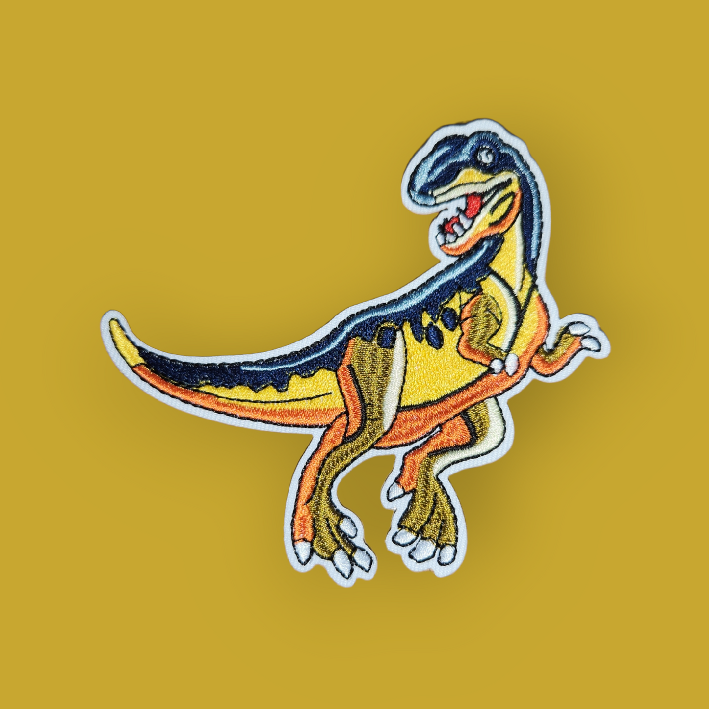 Bügelpatch Dinosaurier gelb-orange-blau 10x10cm